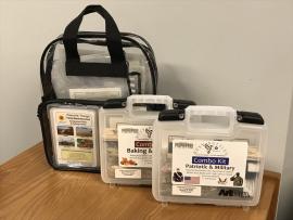 three memory kits in clear plastic backpacks and cases